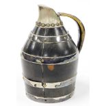 An early 20thC coopered jug, with mahogany body having silver plated straps, and brass handle, 19cm