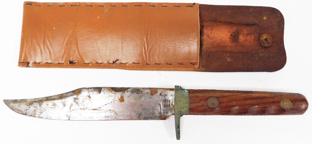 An English sheath knife and cover, the blade stamped William Rogers Sheffield London, with turned wo