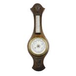 A 20thC mahogany aneroid barometer, the top with temperature dial, the base with ceramic circular di