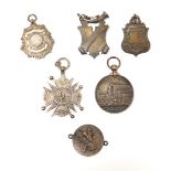 Various silver and other fobs and medals, comprising a Crystal Palace 1885 medallion, a silver shiel
