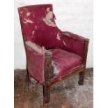 A Victorian Gothic design upholstered library armchair.