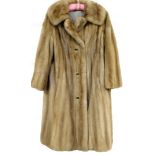 A ladies Bradleys fur coat, three quarter length.