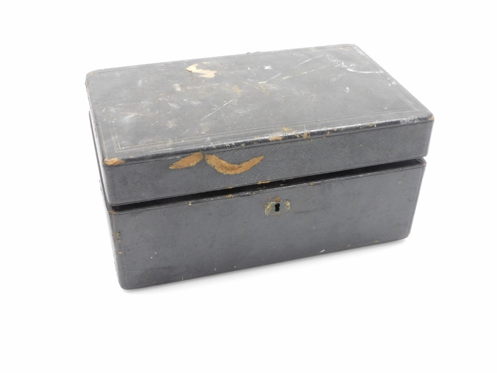 A black leather writing box, with single key hinged lock, with a blue lined interior, stamped Briggs