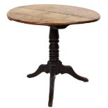 A Georgian oak supper table, with oval tilt top, turned pillar and three out splay legs, 71cm high,