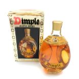 A Dimple Scotch whisky decanter, in presentation box, full.