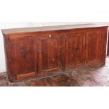 A 19thC pine counter top cupboard, with four door fielded panel base, 92cm high, 217cm wide, 59cm de