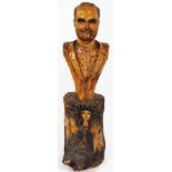 Willard Wigan M.B.E. (b.1957). Gianni Versace, a rustic carved head and torso portrait bust, over th
