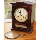 An early 20thC mahogany mantel clock, eight day movement, coil strike, with white enamel clock face