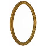 A late Victorian oval wall mirror, with moulded frame and oval bevel plate, 85cm x 60cm.