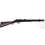 A Victorian Martini Enfield carbine, stamped VR over ENFIELD, dated 1873, the mahogany butt having b