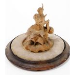 An early 19thC carved lindenwood sculpture of a snail on a root carving, applied to a circular base,