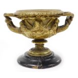A 19thC cast bronze Grand Tour model of the Warwick vase, 11cm high, plus wooden socle.