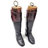 A pair of vintage leather wide calf hunting boots, size 10 with beechwood trees, the trees by Charle