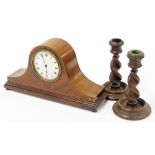 An Edwardian inlaid mahogany mantel clock, with timepiece movement 31cm wide, and a pair of dwarf ba