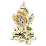 A 19thC French porcelain mantel clock, of scrolling rococo form with green floral panels within gilt