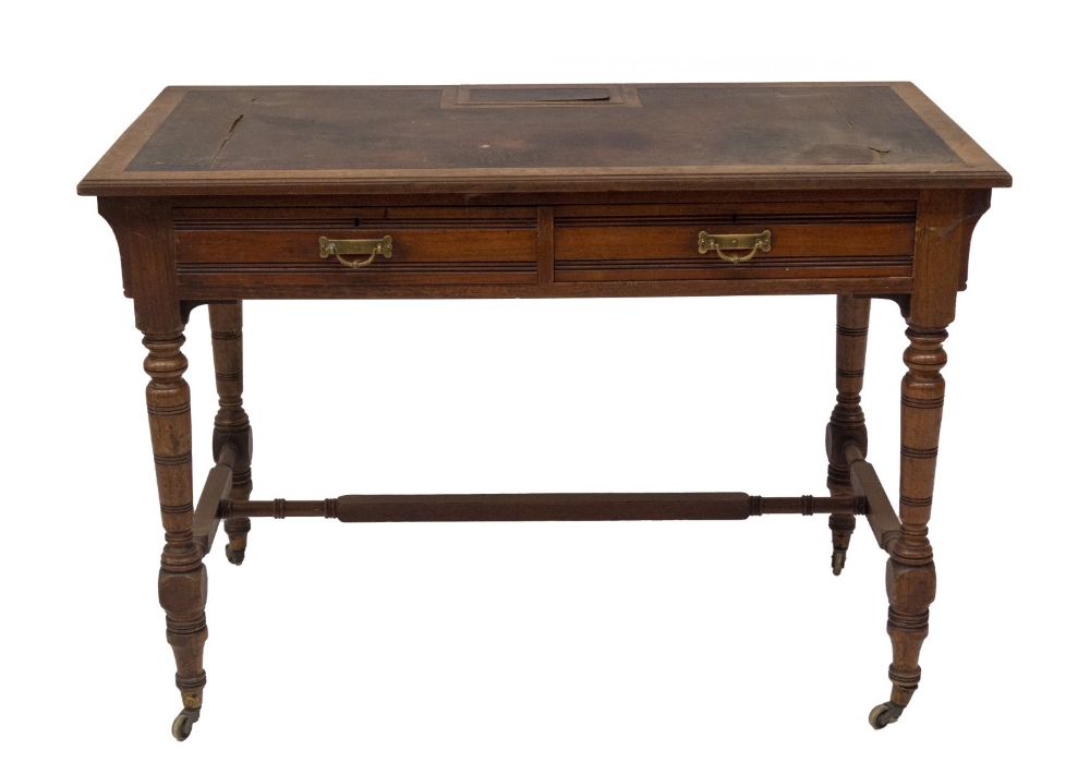 A late 19thC American walnut chamber or writing table by Gillows of Lancaster, having leather moulde