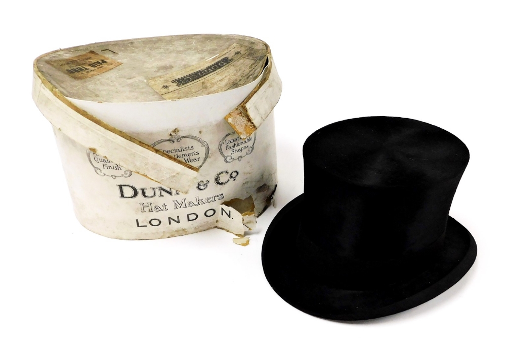 A vintage silk top hat, 15.5cm x 19.5cm, in a Dunn & Co vintage hat box. (AF)