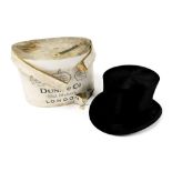 A vintage silk top hat, 15.5cm x 19.5cm, in a Dunn & Co vintage hat box. (AF)