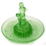 An Art Deco green glass bowl and centrepiece, the centrepiece with two children, with a lily design