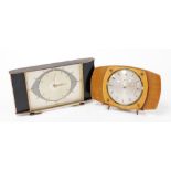 Two Metamec Art Deco mantel clocks, one in black wooden design with chrome finish face, the other in