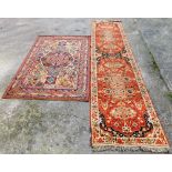 Two rugs, to include an Eastern style runner, with orange and blue medallion ground, together with a