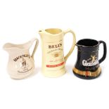 Three whisky advertising jugs, to include Mackinlay's jug, a Bells Old Scotch whisky Extra Special j