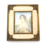 An early 19thC portrait miniature of a lady, the half length portrait of lady in white evening dress