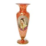 An early 20thC Vienna cranberry glass vase, with oval over painted panel depicting a maiden in purpl