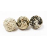 Three bounding Bile type golf balls, probably early 20thC, marked 4cm diameter. (3 AF)