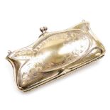 A silver plated Victorian coin purse, of shaped design with foliate scrolling and vacant shield cart