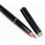 A Montblanc No. 22 fountain pen, in black with gold plated mounts, the nib stamped 585.