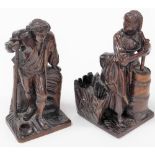 A pair of early 18thC continental walnut carvings, one depicting a gentleman with a long pipe, 22cm