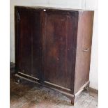 An early 19thC mahogany housekeeper's linen press, with two doors revealing pine press drawers and h