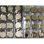 A world coin stock coin album and contents, comprising nineteen collectors fifty pence pieces, vario