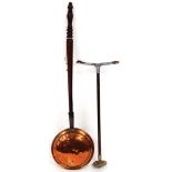 A copper warming pan and a shooting stick. (2)