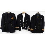 Three Naval dress uniforms and accessories.