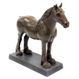 A brown patinated bronze effect resin figure of a heavy horse, on metal plinth 25.5cm high overall.