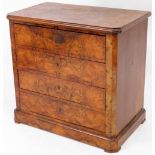 A 19thC Biedermeier figured walnut chest of four drawers, with moulded top, canted sides and moulded