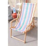 A striped wooden decking chair.