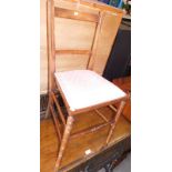 An Edwardian mahogany bedroom chair, with pink upholstered seat, 83cm high, 39cm wide.