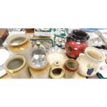 A quantity of stonewares, to include three stoneware bowls, stoneware spice jars, cheese dome, decor