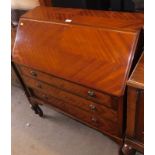 An early 20thC walnut bureau, the full flap opening to reveal letter and drawer section with a brown