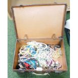 A group of modern costume jewellery, necklaces, cameos, etc., all enclosed in one leather trunk.