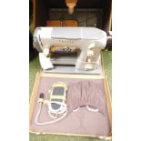 A Cresta cased electric sewing machine, in blue.