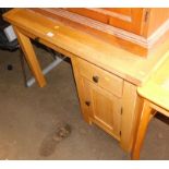 An oak office desk, with pull out keyboard drawer and pedestal with single drawer and cupboard base,