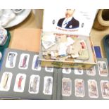 A quantity of cigarette cards and loose stamps, to include two albums containing Wills and Players c