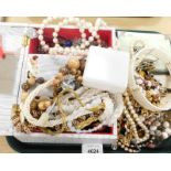 A small quantity a costume jewellery, comprising faux pearl necklaces, beaded necklaces, music box,