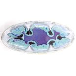 An art pottery boat shaped dish, with mottled decoration in blue, turquoise, purple, white, etc., un
