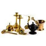 A pair of ecclesiastical brass candlesticks, of plain form, a bronze two handled urn, a pestle and m