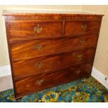 A George III mahogany chest, of two short and three long graduated drawers, with brass swan neck han